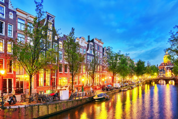 Westerkerk (Western Church), with water canal view in Amsterdam.