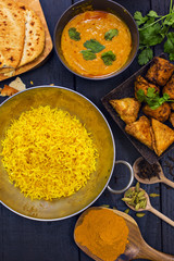 Indian pilau rice in balti dish served with chicken tikka masala