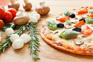 Pizza with mushrooms and vegetables