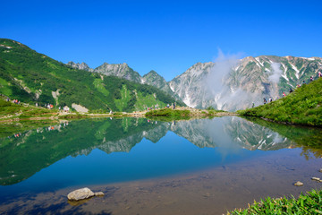 Naklejka na ściany i meble Shirouma mountains and Happo-ike Pond at Happo-one in Hakuba, Nagano, Japan
