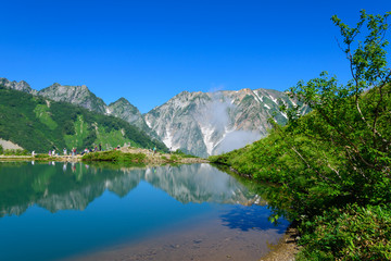 Fototapeta na wymiar Shirouma mountains and Happo-ike Pond at Happo-one in Hakuba, Nagano, Japan