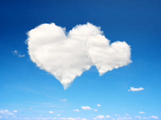 Naklejka na ściany i meble Blue sky with a white clouds in the form of heart. Valentines day.