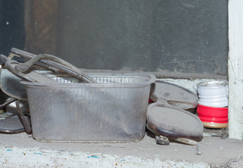 objects on the windowsill in an abandoned house in dust