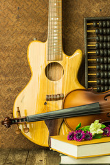 Fototapeta premium acoustic guitar and violin with old steel background