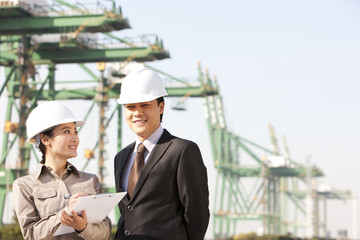 businessman with shipping industry worker