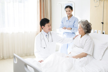 Fototapeta premium Medical workers with patient in hospital