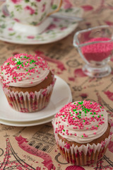 Chocolate cupcakes on pink background