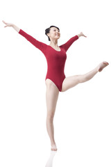 Obraz premium Female gymnast performing rhythmic gymnastics