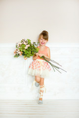 the girl the ballerina with flowers
