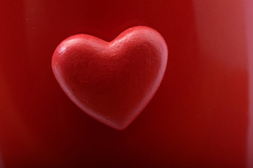 Red heart on red background
