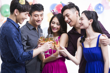 Young adults toasting in party