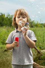 boy play in bubbles