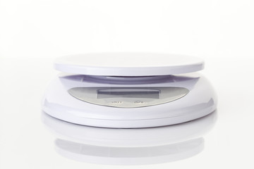 Digital food scale electronic weight balance on white backgrooun