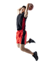 Man jumping to shoot basketball © Blue Jean Images