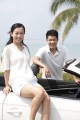 Happy Couple Posing In a Convertible