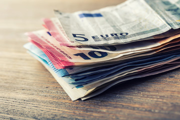 Several hundred euro banknotes stacked by value. Euro money concept. Euro banknotes. Euro money. Euro currency. Banknotes stacked on each other in different positions. Toned photo