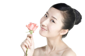 Beauty shot of a young woman holding a rose