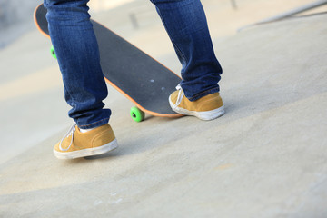 skateboarding legs at skatepark