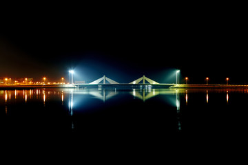 HDR of Sheikh Isa Bin Salman causeway Bridge and reflection on water