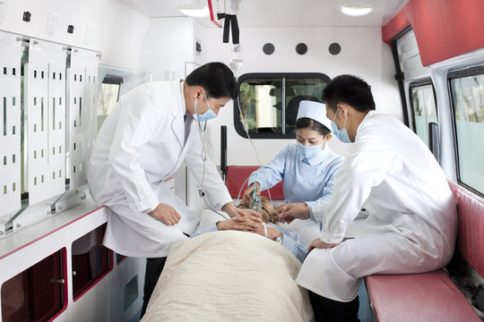 Medics treating a patient in an ambulance