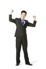 Businessman arms raised in celebration
