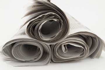 Heap rolls of newspapers
