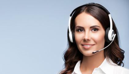Female customer support phone operator in headset