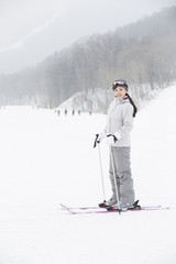 Portrait of young female skier