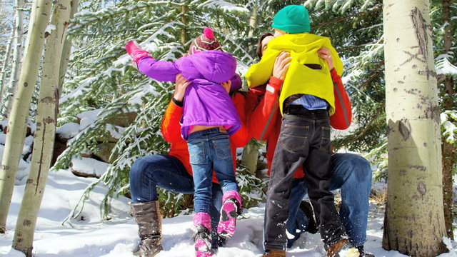 Caucasian family parents children healthy lifestyle snow mountains destination