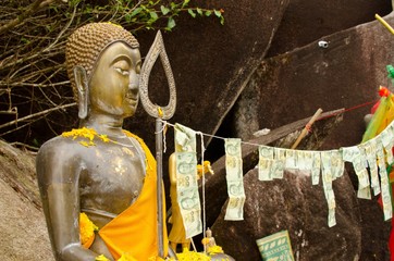 Buddhist statue with offerings