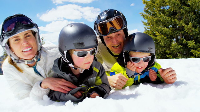 portrait Caucasian family snow mountain skiing children boys outdoor lifestyle