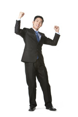 Businessman arms raised in celebration