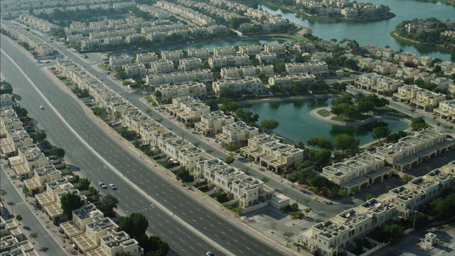 Aerial Dubai luxury homes Emirates Hills Golf Persian Gulf UAE