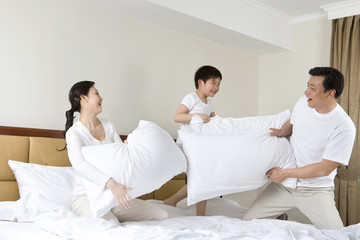 Family having pillow fight