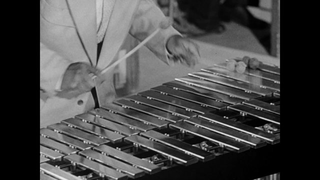 Closeup of  xylophone player performing, 1950s