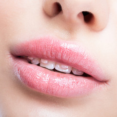 Fototapeta premium Closeup of woman open smiling mouth with brackets