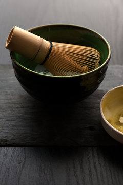 Closeup of the bowl and bamboo whisk for a preparation of matcha tea