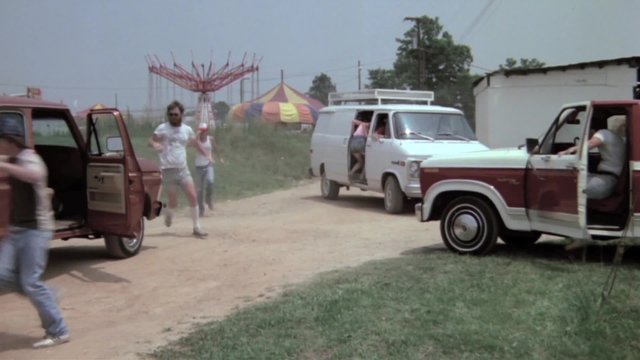People rushing to their cars and leaving amusement park