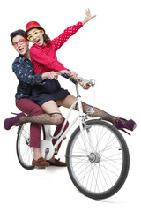 Fototapeta na wymiar Young couple riding on a bike