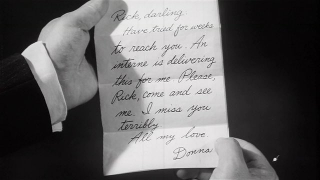 Close-up of man's hands holding love letter