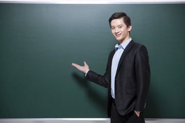 Professional male teacher in classroom