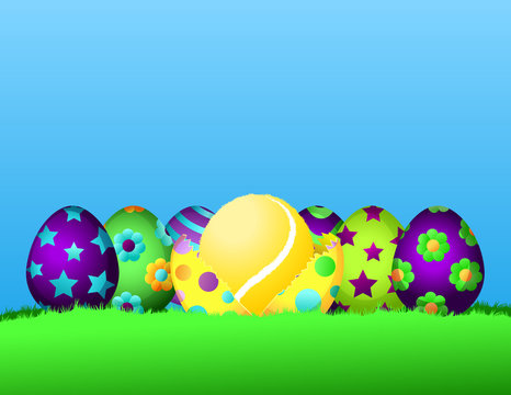 Row of brightly painted Easter eggs siting in the grass.  The center egg is cracked open with a tennis ball inside.
