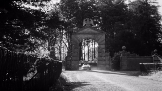 Car driving towards Howth Castle in Ireland, 1960s