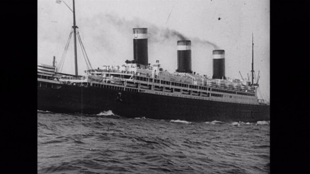 Wide shot of ship sailing on sea