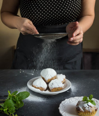 muffins with caster sugar hands, sprinkle with powdered sugar muffins