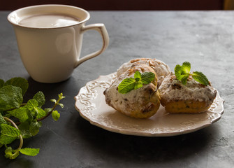 Homemade muffins with mint and cup of tea