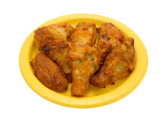 Serving of chicken wings on a yellow paper plate