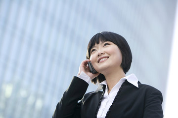 Businesswoman using cellphone