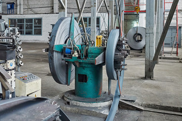 Steel sheet is wound on a roll on a special machine