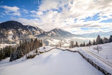 Fototapeta na wymiar View to a winter landscape with mountain range and Gasteinertal valley near Bad Gastein, Pongau Alps - Salzburg Austria Europe